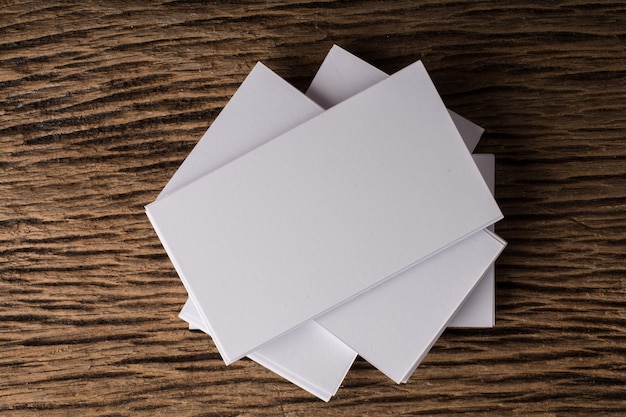 Free Photo blank white business card presentation of corporate identity on wood background