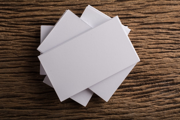 Free Photo blank white business card presentation of corporate identity on wood background