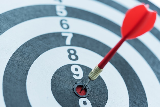Free Photo dart target arrow hitting on bullseye with sun light